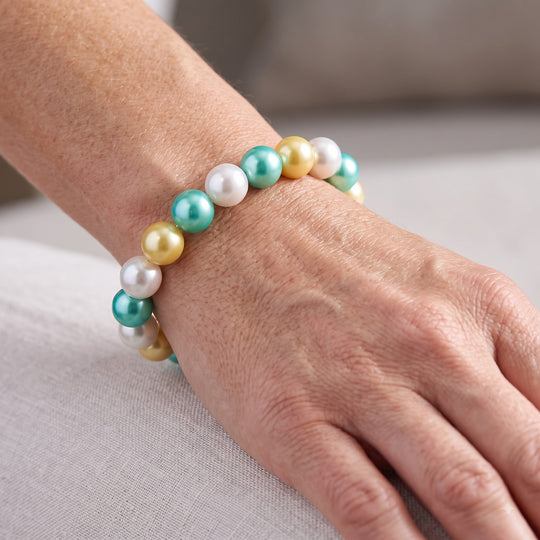 Flexibles, goldenes, weißes und grünes Muschelkernperlen-Armband
