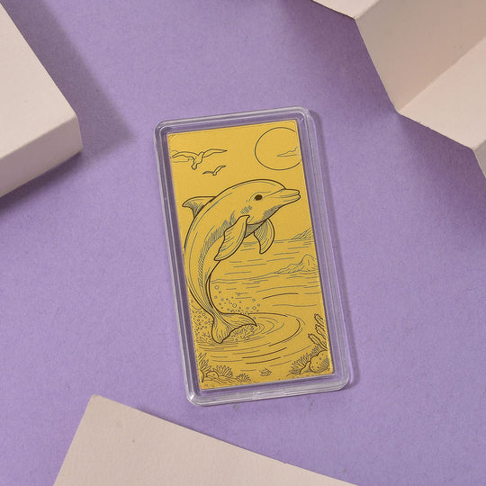 999er Goldbarren mit Delfin-Motiv