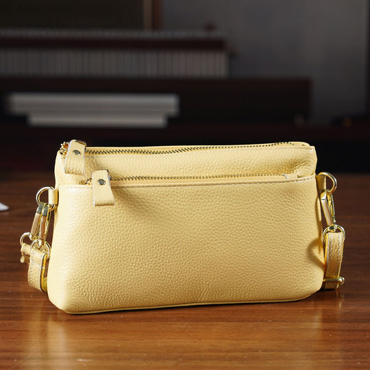 Leder Crossbody Tasche mit mehreren Reißverschlussfächern und verstellbarem Schulterriemen 21.5 x 4 x 13 cm Gelb