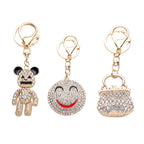 3er Set - Weiße Kristall-Schlüsselanhänger, Smiley, Bär, Tasche