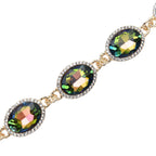 Grünes Glaskristall Armband und Ohringe, goldfarben