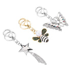 3er Set - mehrfarbige Kristall Sternschnuppe-, Biene- und Schmetterling-Schlüsselanhänger 26.60 ct