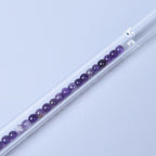 Glas Trinkhalme, gefüllt mit Edelsteinen, Amethyst