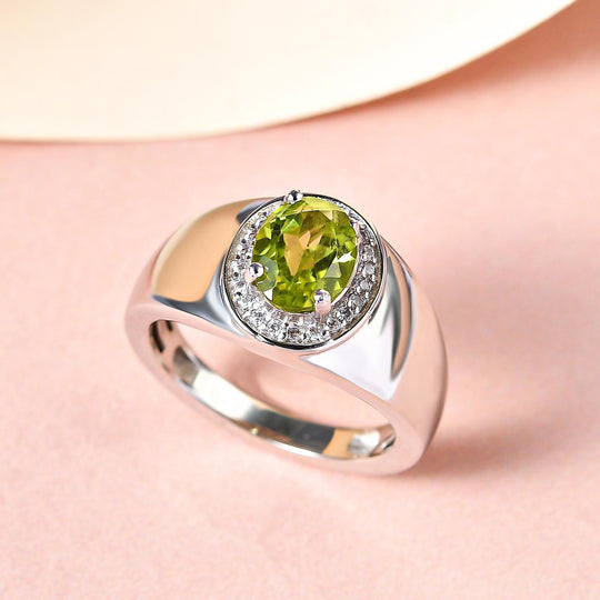 Peridot und weißer Zirkon-Ring, Messing platiniert (Größe 21.00) ca. 1,40 ct