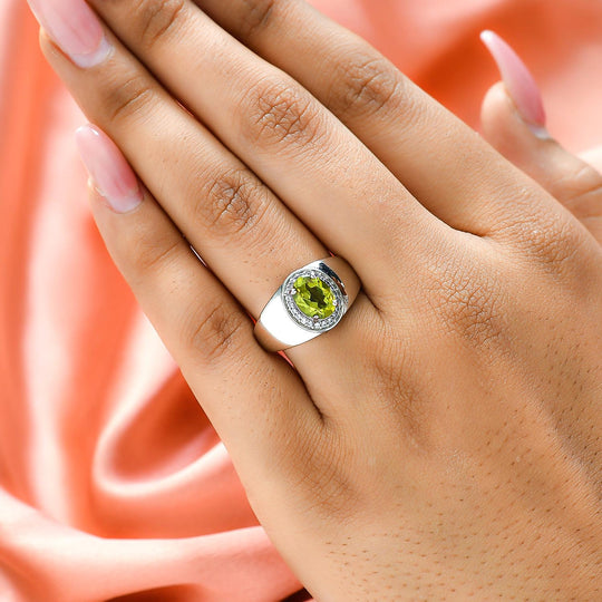 Peridot und weißer Zirkon-Ring, Messing platiniert (Größe 21.00) ca. 1,40 ct