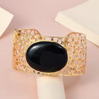 Schwarzer Onyx Armreif, ca. 19 cm, Messing vergoldet ca. 73.87 ct
