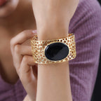 Schwarzer Onyx Armreif, ca. 19 cm, Messing vergoldet ca. 73.87 ct