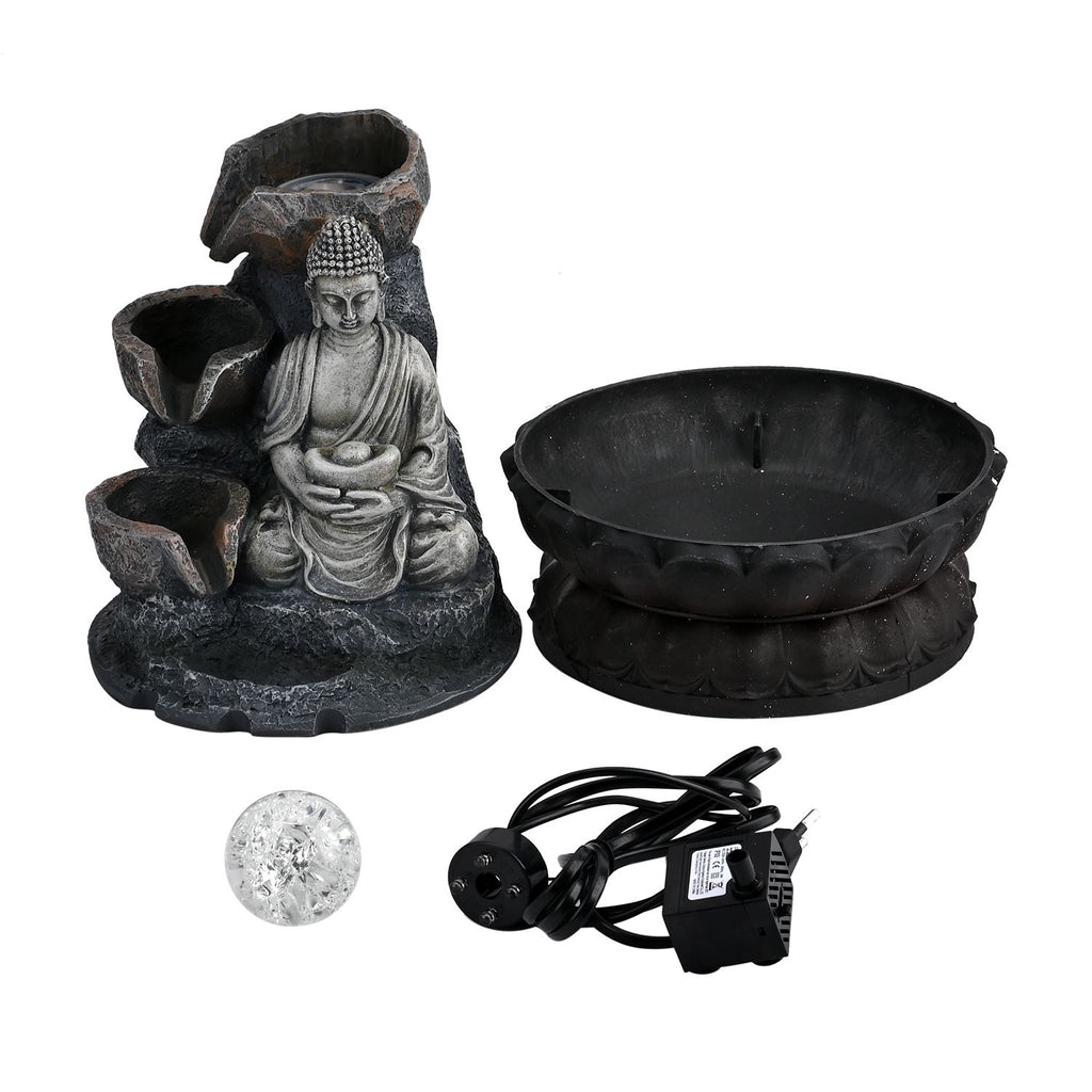 Buddha mit Glaskugel und Licht
