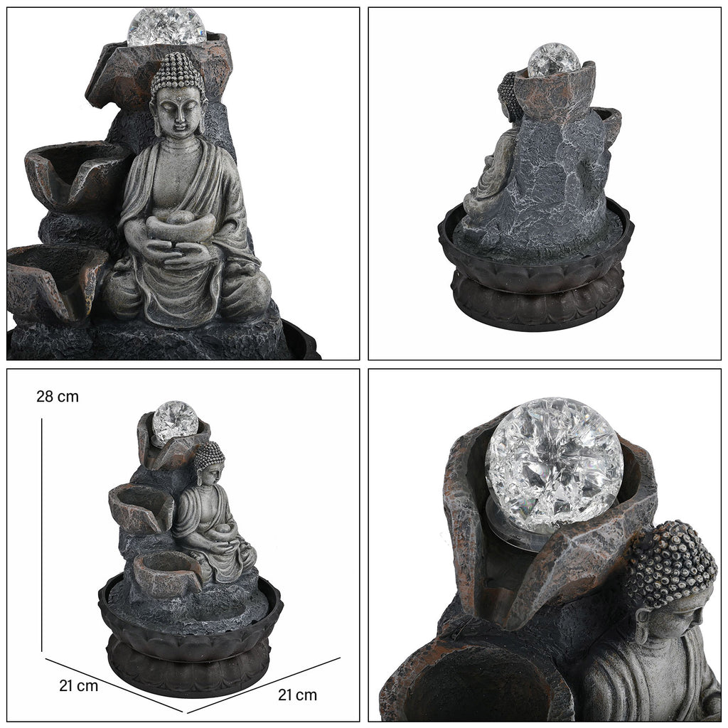 Buddha mit Glaskugel und Licht