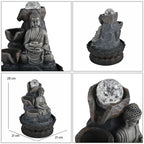 Buddha mit Glaskugel und Licht