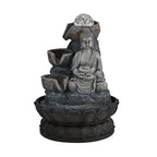 Buddha mit Glaskugel und Licht