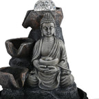 Buddha mit Glaskugel und Licht