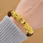 Tigerauge Armband, flexibel, vergoldet ca. 150,00 ct.