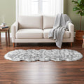 LIVMORE Kunstfell-Teppich im Dip-Dye-Look mit Schaumstoffunterlage, geschwungene Form, 60x180cm, Schwarz