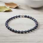 Pfaufarbene Oval Muschelkernperle 50cm Halskette und flexibles Armband