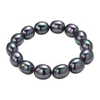 Pfaufarbene Oval Muschelkernperle 50cm Halskette und flexibles Armband